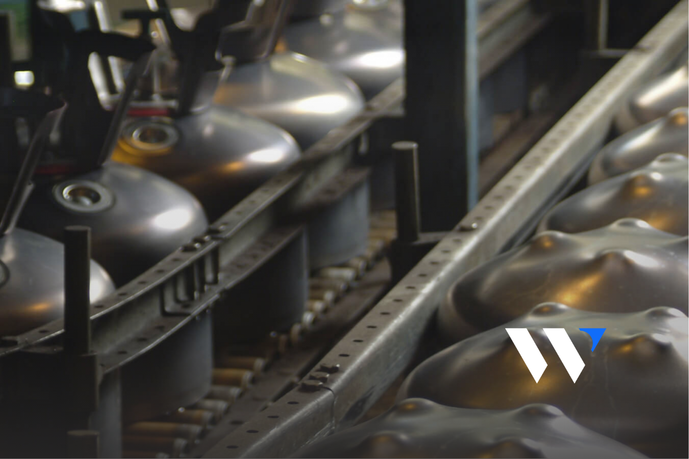 Unfinished cylinders on conveyor belt