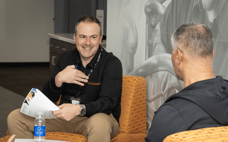 Two men in chairs chatting
