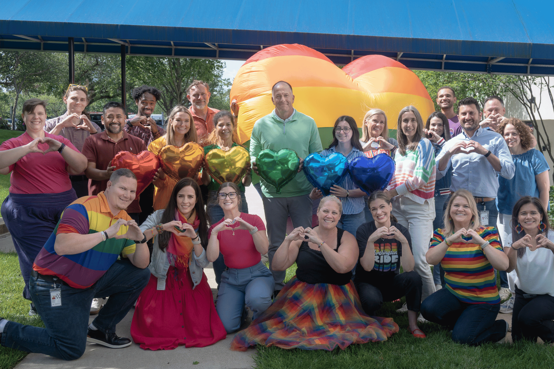 Group of employees wearing rainbow colors